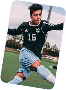 Soccer player in black jersey with number 16 and light blue shorts kicking a ball on a grassy field.